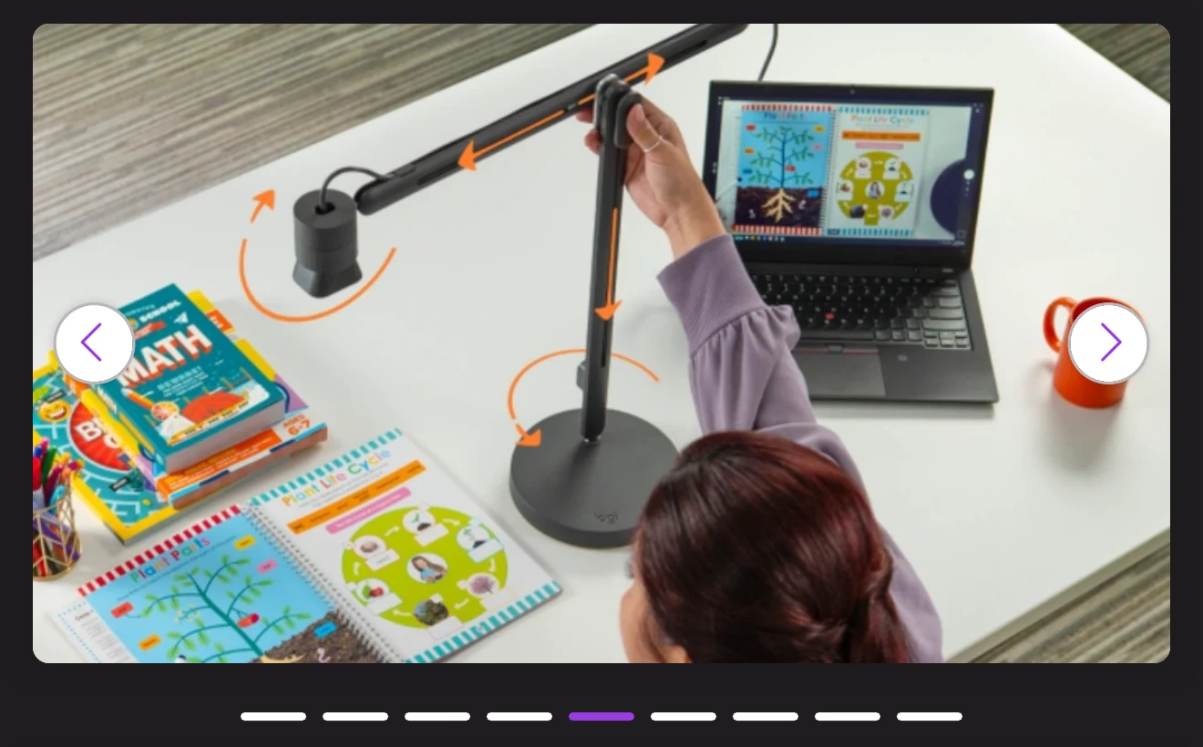Mobile campaign hero: featured gallery image of the Logitech Reach arm being adjusted over a tabletop of school workbooks, overlaid with orange arrows tracing every articulation point.