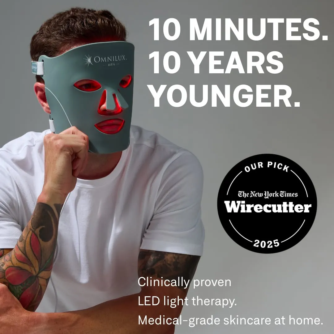 Omnilux Men ad image: a man in a white T-shirt with a tattooed arm holds the sage-green LED mask over his face, its red light showing through, beside “10 minutes. 10 years younger.”, a New York Times Wirecutter 2025 Our Pick seal, and the line “Clinically proven LED light therapy. Medical-grade skincare at home.”