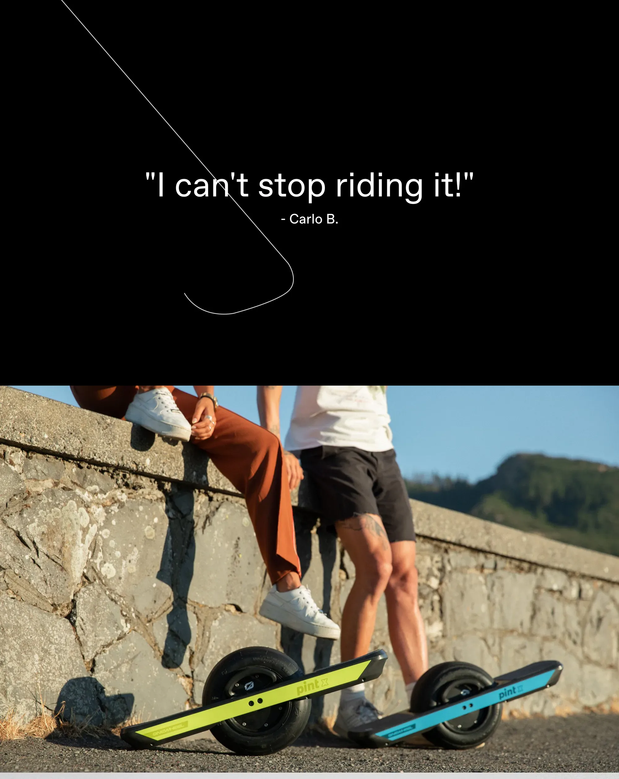 Full-bleed black quote panel reading '"I can't stop riding it!" - Carlo B.' above a golden-hour photo of two riders resting against a stone wall, their lime and blue Pint X boards parked on the pavement below.
