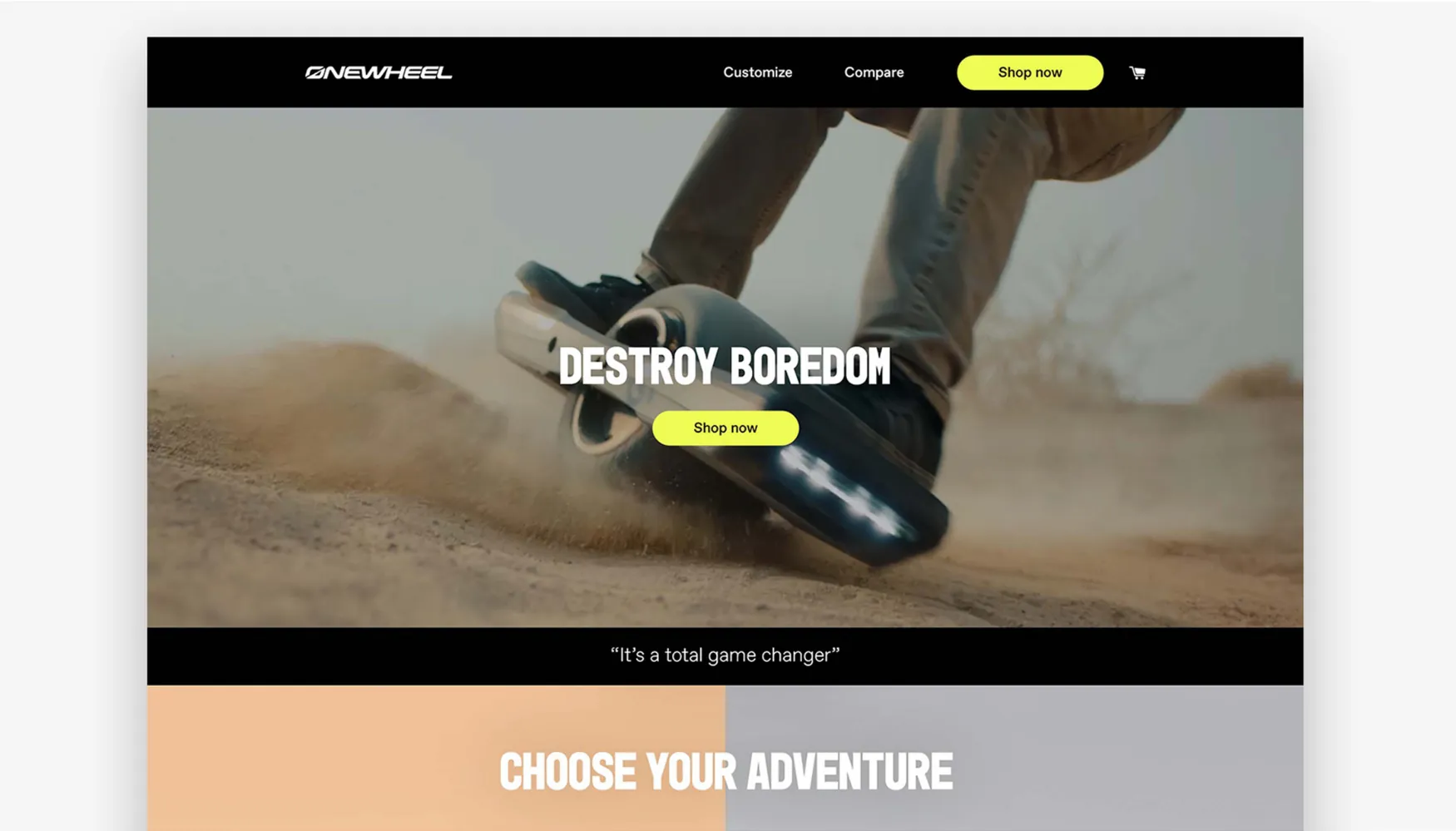 A carousel slide showing a screenshot of the Onewheel website: a black header with Customize, Compare and a yellow Shop now button; the headline DESTROY BOREDOM and a Shop now button over a rider’s sneakers on a board kicking up dirt; the line “It’s a total game changer”; and the top of a CHOOSE YOUR ADVENTURE band.